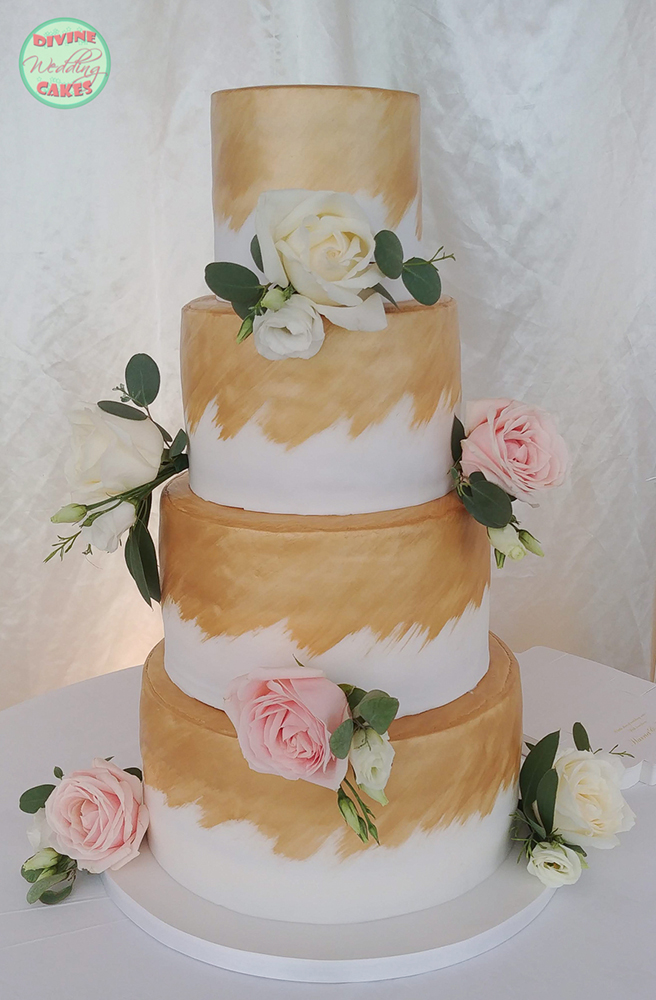 Fondant iced cake with roses and gold colouring