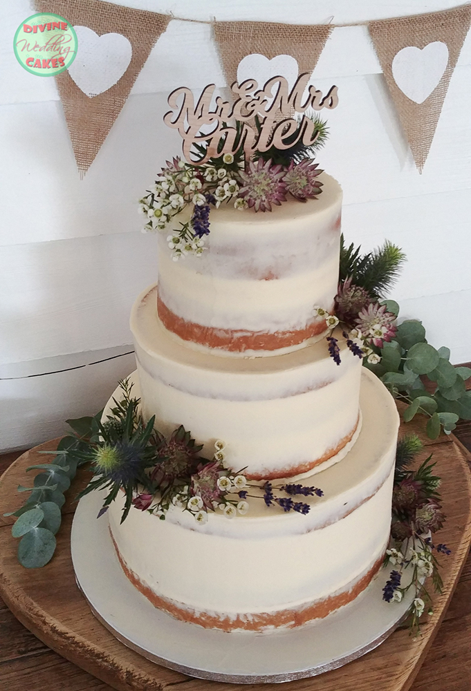 Semi-naked rustic cake with fresh flowers