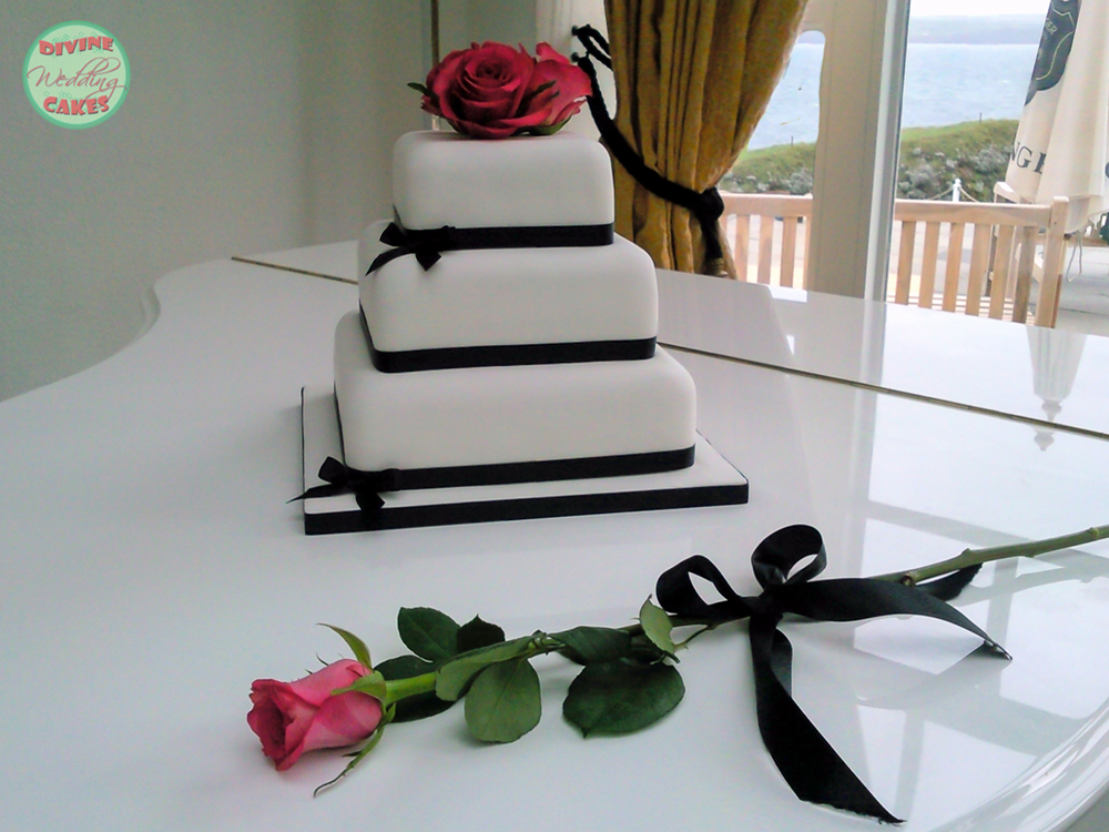 Fondant iced wedding cake with fresh roses